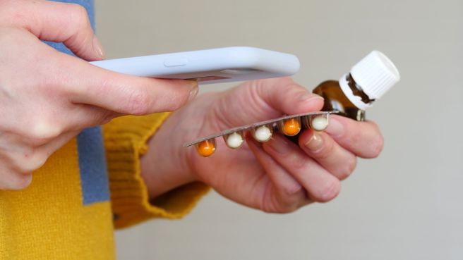 patient checking medicines information